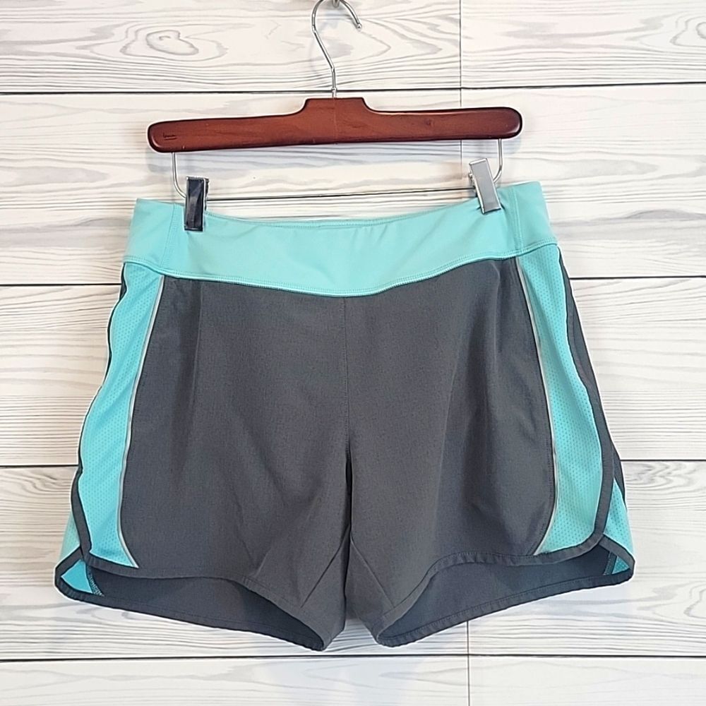 Lucy Flex Women's athletic shorts with lined bikini bottoms Size M